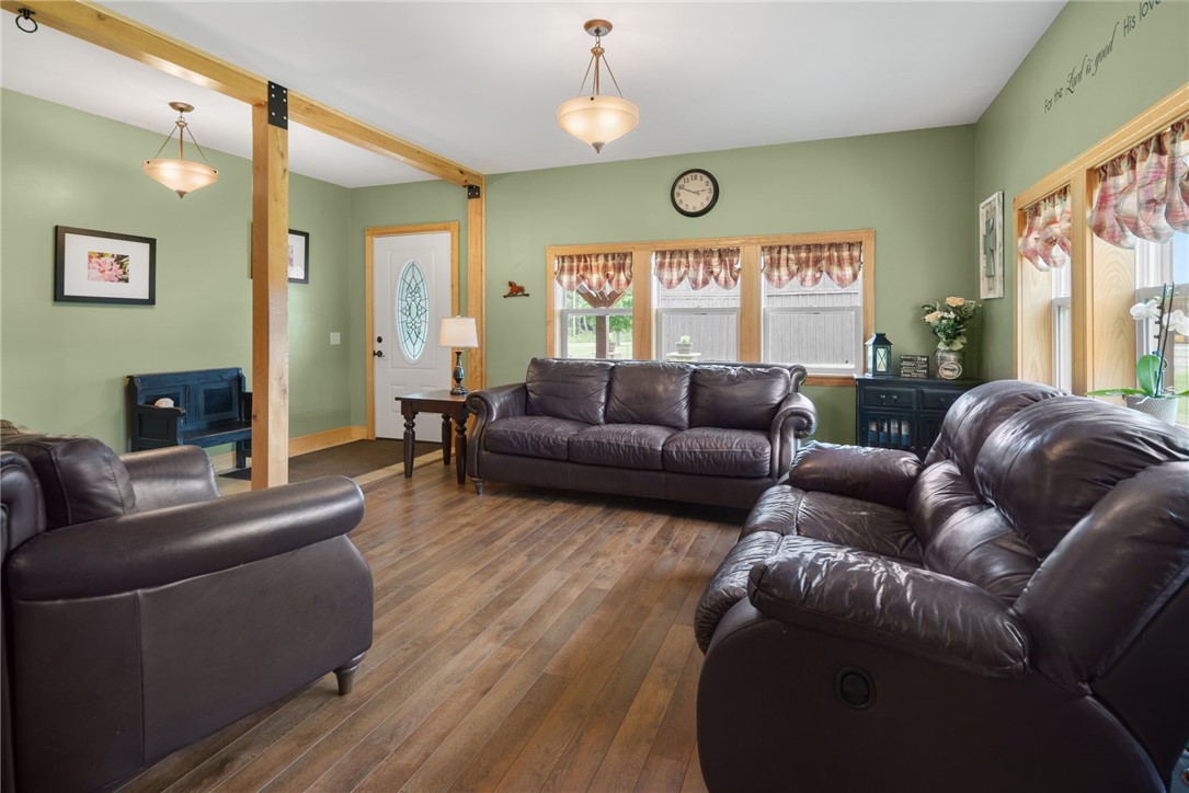 5903 Howell Road Locke, NY 13092 - Photo 6 of 44 Inviting living room with rich hardwood trim