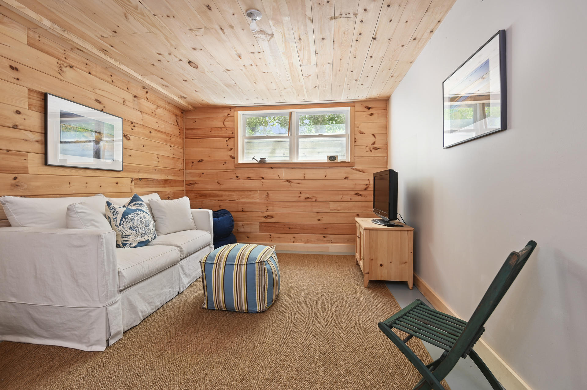245 Cahoon Hollow Road Wellfleet, MA 02667 - Photo 26 of 36 a living room with furniture and a window