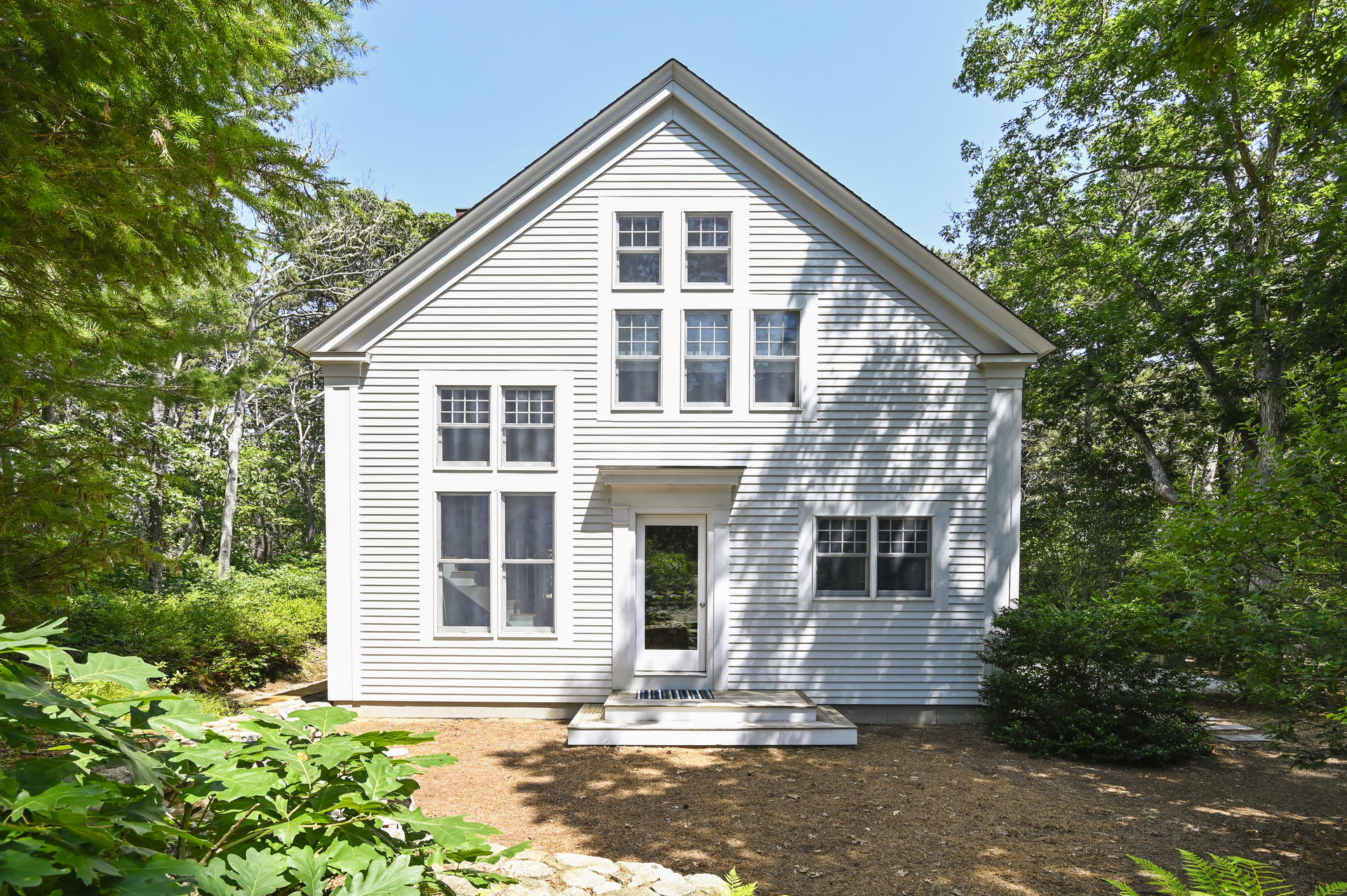 245 Cahoon Hollow Road Wellfleet, MA 02667 - Photo 36 of 36 a front view of a house with a yard