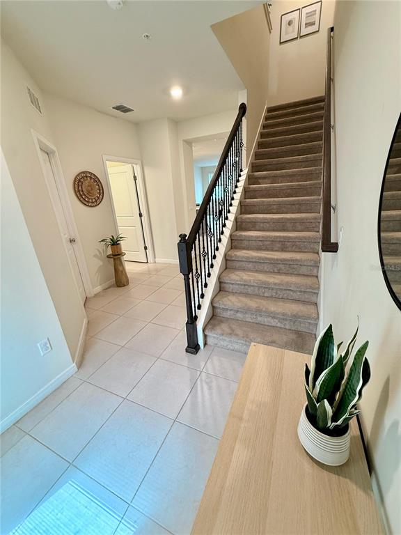 10923 Leafshore Loop Orlando, FL 32829 - Photo 14 of 44 a dining room with furniture and a potted plant