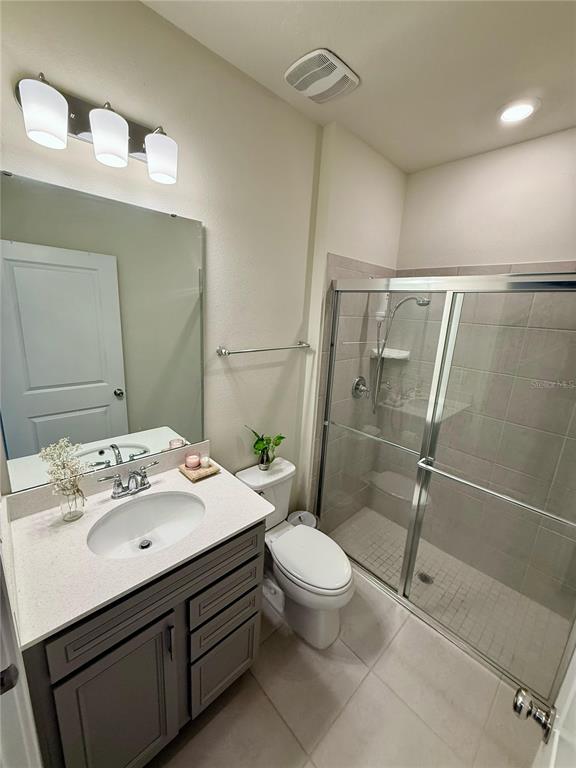 10923 Leafshore Loop Orlando, FL 32829 - Photo 15 of 44 a bathroom with a sink a toilet and shower