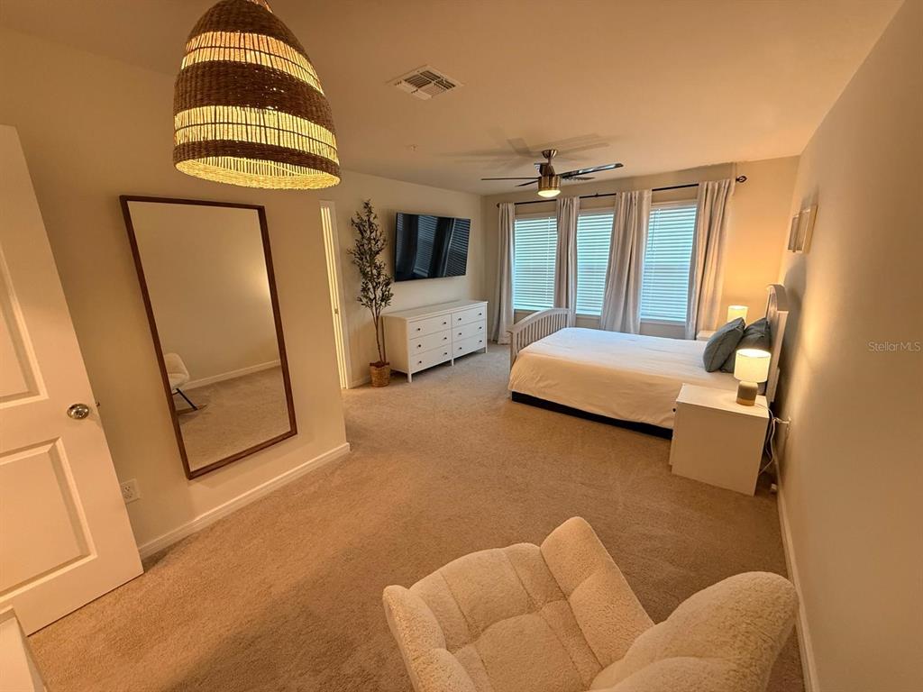 10923 Leafshore Loop Orlando, FL 32829 - Photo 25 of 44 a bedroom with furniture and a window