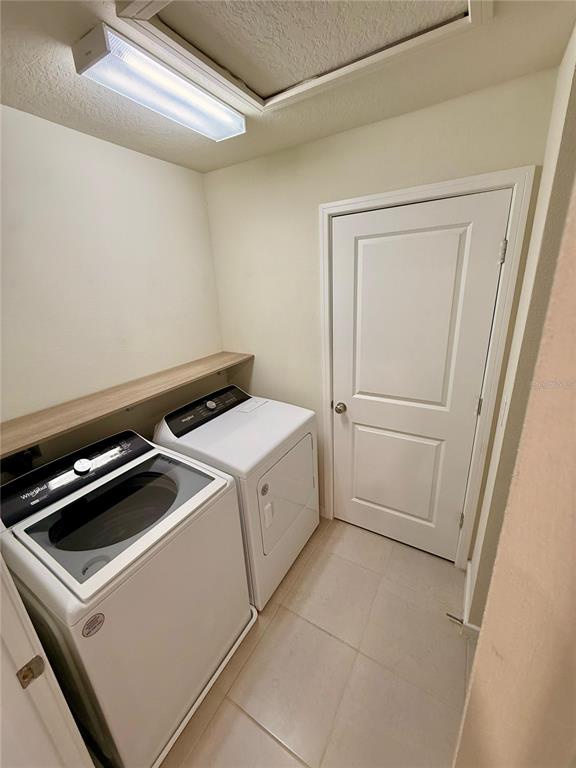 10923 Leafshore Loop Orlando, FL 32829 - Photo 30 of 44 a utility room with dryer and washer