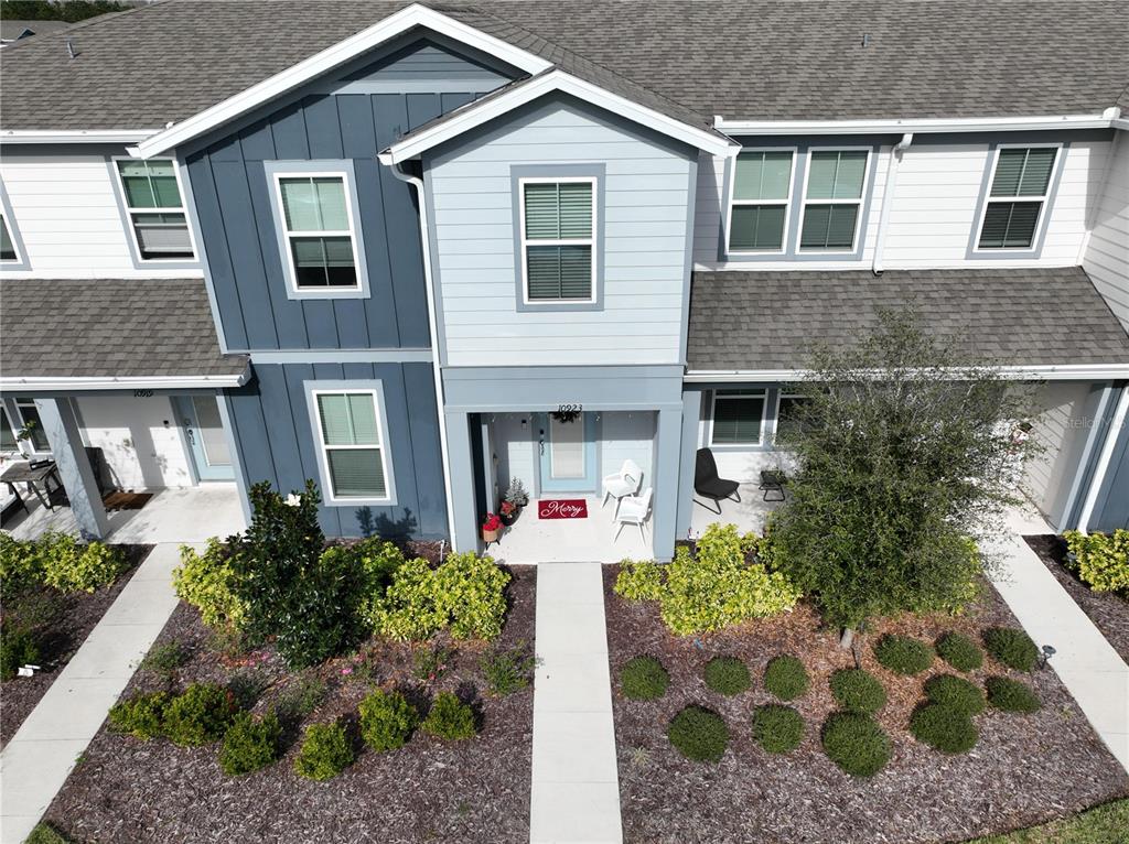 10923 Leafshore Loop Orlando, FL 32829 - Photo 3 of 44 a front view of a house with garden