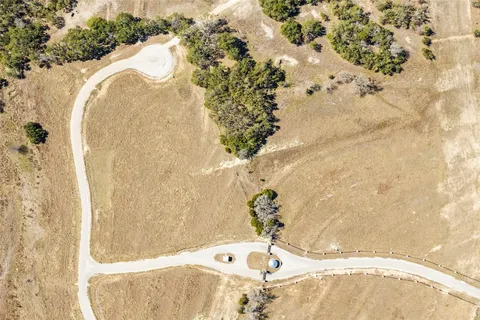 a bathroom with a bathtub and mirror