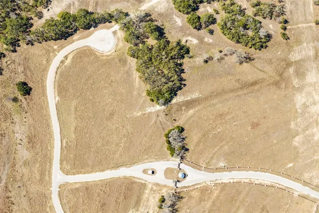 a bathroom with a bathtub and mirror