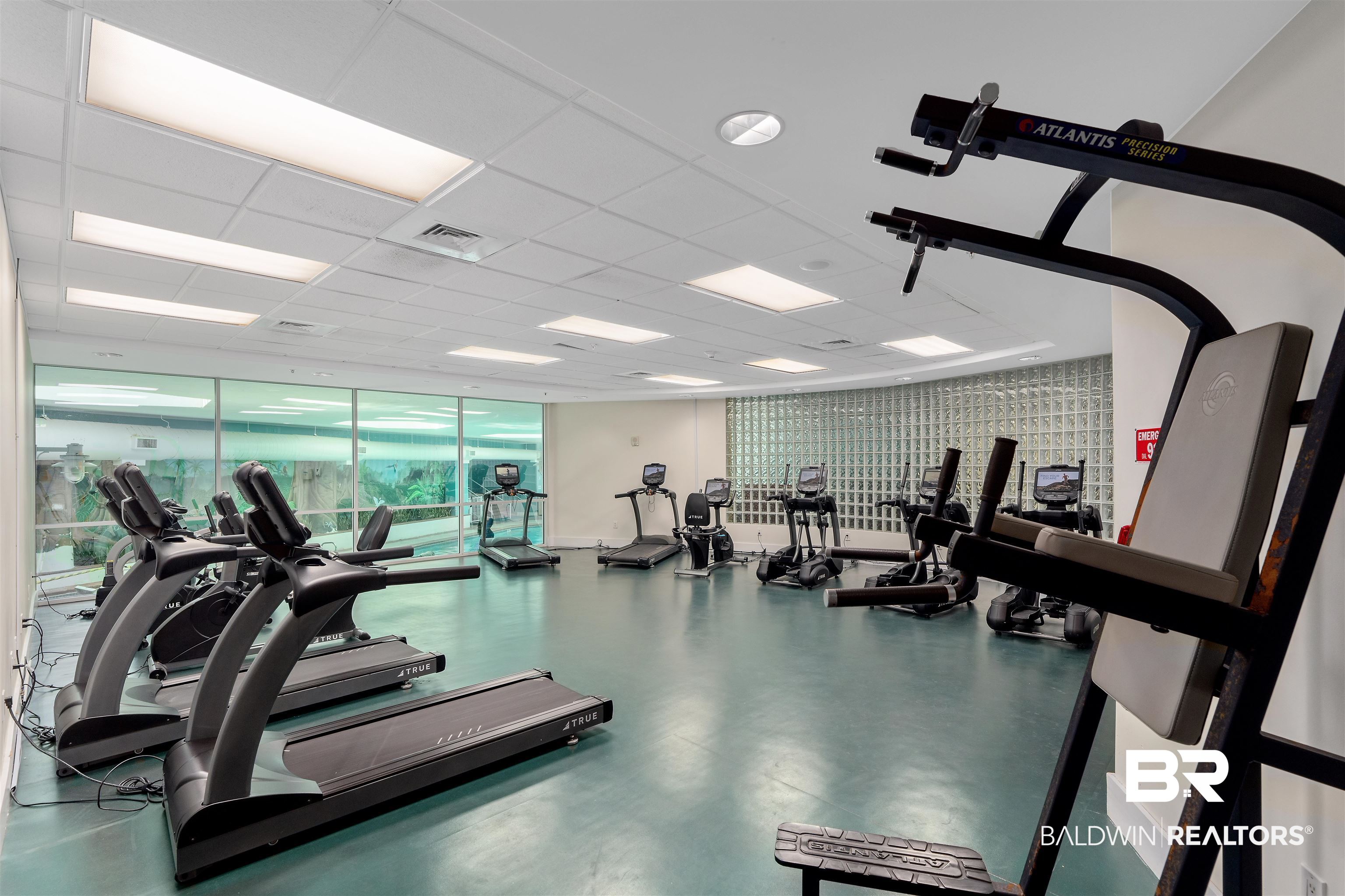 28107 Perdido Beach Boulevard, Unit DPH06 Orange Beach, AL 36561 - Photo 45 of 70 Gym featuring a wall of windows and a drop ceiling