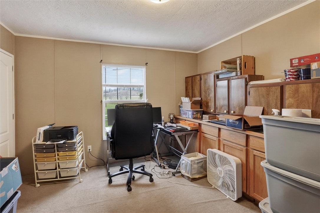 1926 Fairview Road Peebles, OH 45660 - Photo 36 of 44 This spacious office features ample cabinetry and a bright window, perfect for productivity.