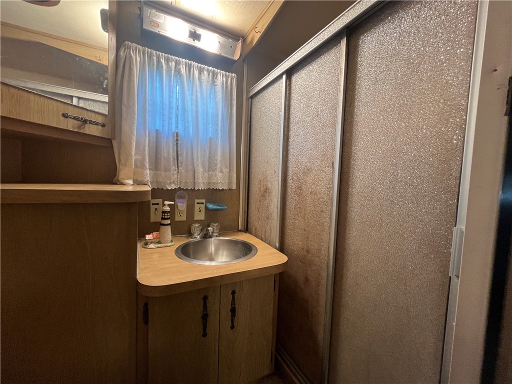 7945 Lake Road, Unit 34 Sodus, NY 14555 - Photo 21 of 24 A STEP IN SHOWER IN THE FULL BATH