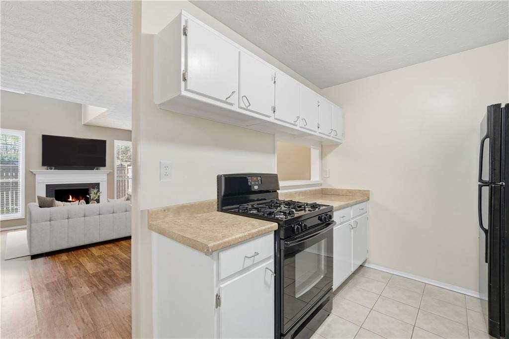 101 Park Ridge Circle Marietta, GA 30068 - Photo 11 of 52 a kitchen with stainless steel appliances granite countertop a stove and a refrigerator