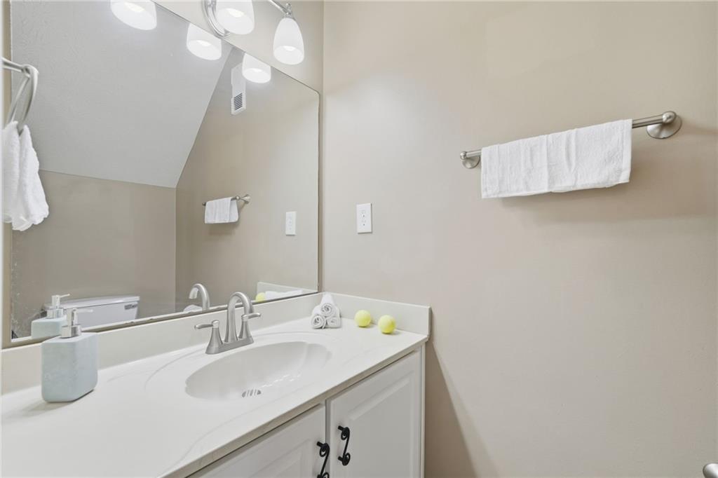 101 Park Ridge Circle Marietta, GA 30068 - Photo 13 of 52 a bathroom with a sink and a mirror