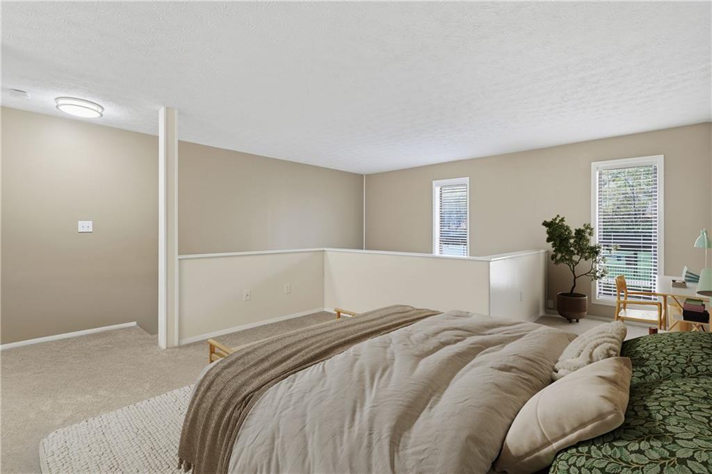 101 Park Ridge Circle Marietta, GA 30068 - Photo 20 of 52 a bedroom with a large bed and potted plant