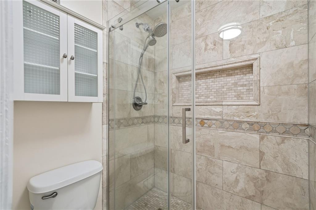 101 Park Ridge Circle Marietta, GA 30068 - Photo 24 of 52 a bathroom with a shower and toilet