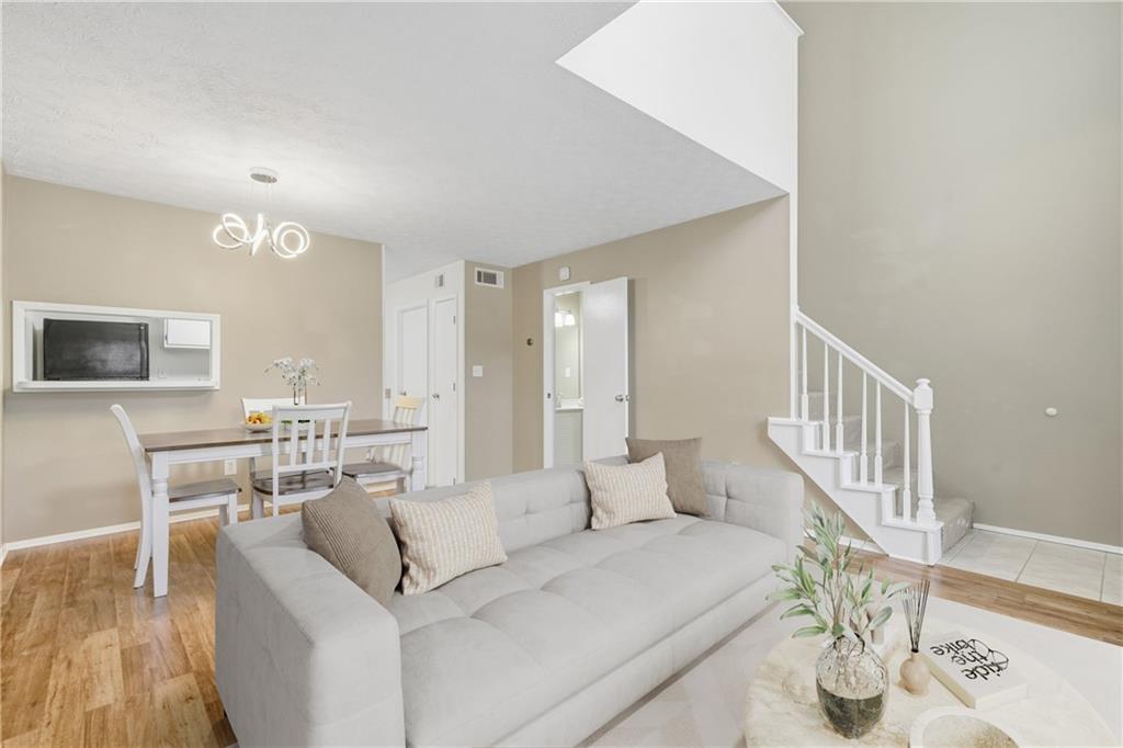 101 Park Ridge Circle Marietta, GA 30068 - Photo 7 of 52 a living room with furniture and a wooden floor