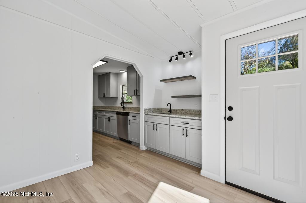560 Quarter Horse Lane Bunnell, FL 32110 - Photo 16 of 66 a kitchen with granite countertop white cabinets and white appliances