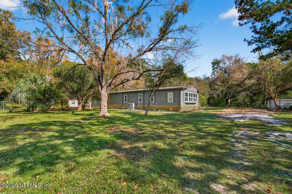 560 Quarter Horse Lane Bunnell, FL 32110 - Photo 2 of 66 a view of a house with a yard