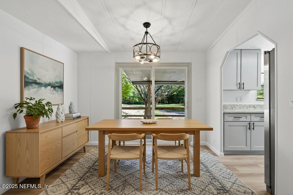 560 Quarter Horse Lane Bunnell, FL 32110 - Photo 25 of 66 a dining room with furniture a chandelier and window