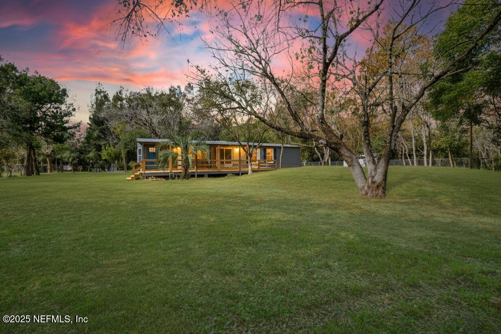 560 Quarter Horse Lane Bunnell, FL 32110 - Photo 3 of 66 a view of a house with a big yard
