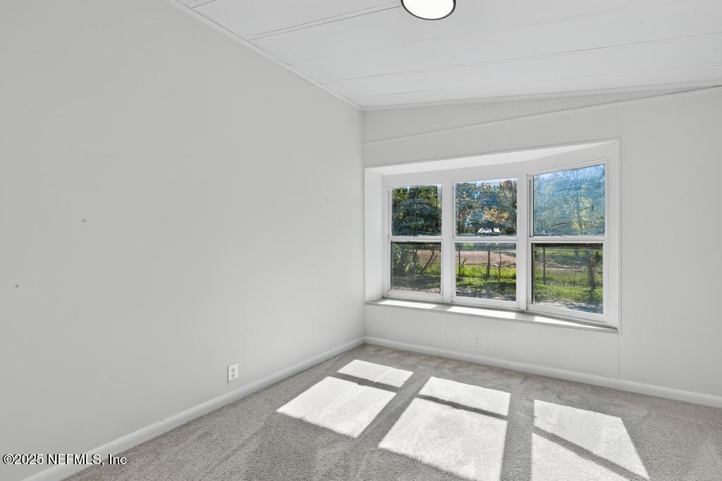 560 Quarter Horse Lane Bunnell, FL 32110 - Photo 36 of 66 a view of an empty room with a window