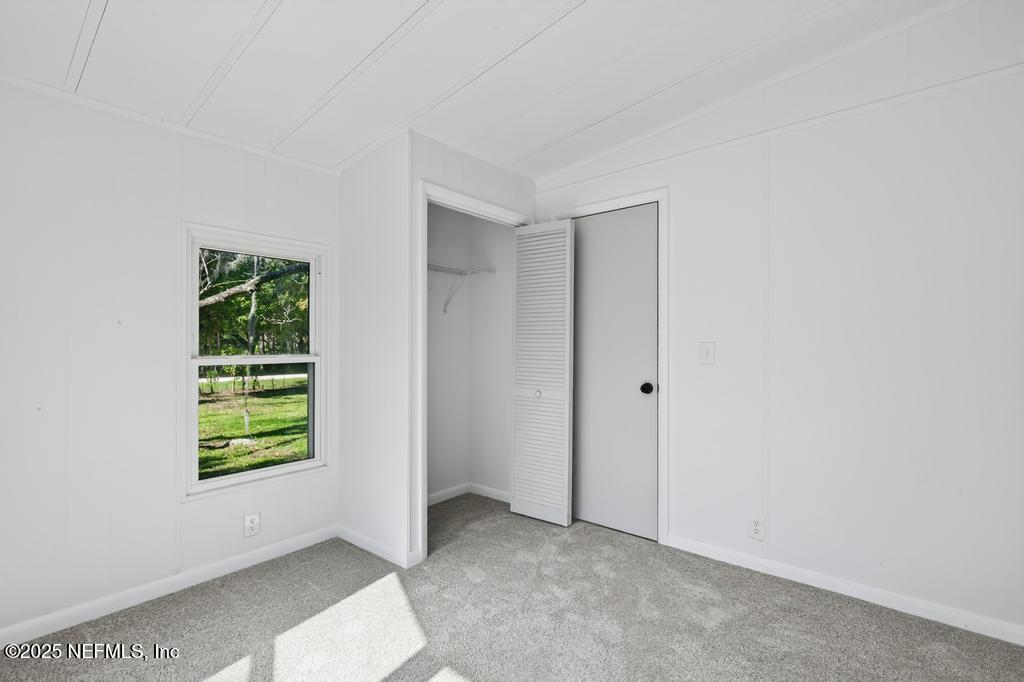 560 Quarter Horse Lane Bunnell, FL 32110 - Photo 38 of 66 an empty room with windows