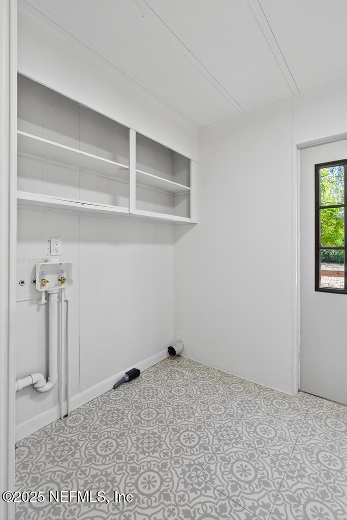 560 Quarter Horse Lane Bunnell, FL 32110 - Photo 41 of 66 a view of a room with rack on the wall