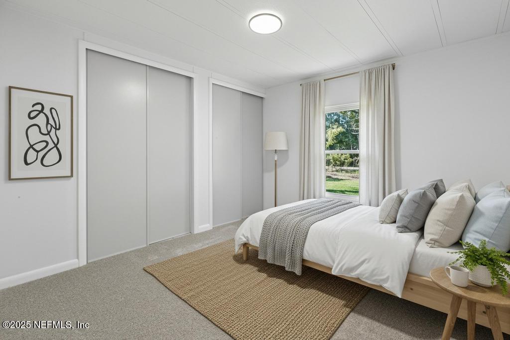 560 Quarter Horse Lane Bunnell, FL 32110 - Photo 42 of 66 a bedroom with a bed and a window