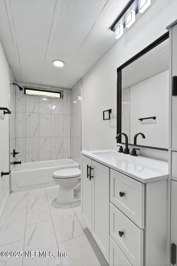 560 Quarter Horse Lane Bunnell, FL 32110 - Photo 47 of 66 a bathroom with a sink a toilet and shower