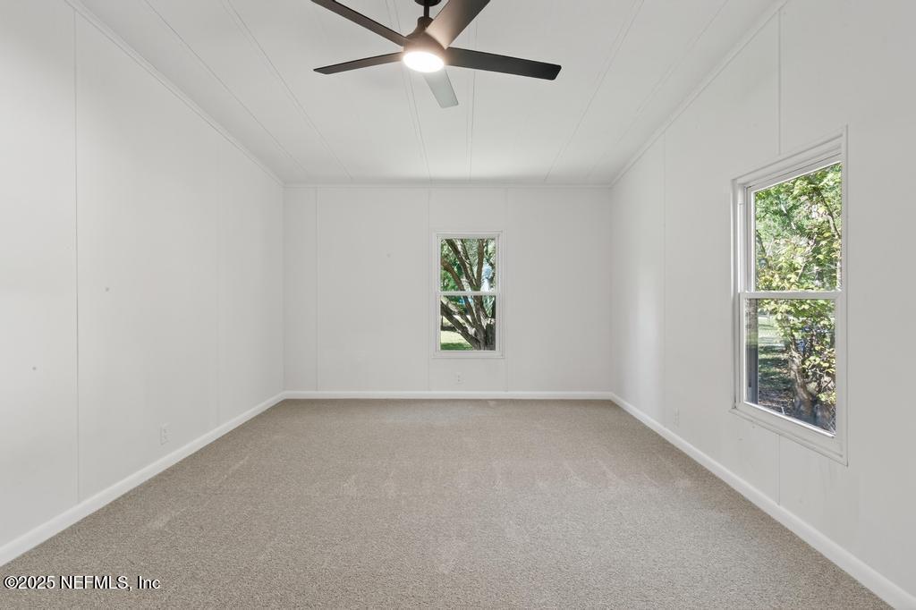 560 Quarter Horse Lane Bunnell, FL 32110 - Photo 51 of 66 an empty room with windows