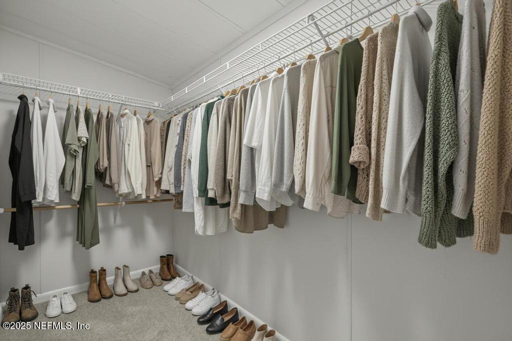 560 Quarter Horse Lane Bunnell, FL 32110 - Photo 53 of 66 a view of walk in closet with clothes and shoes