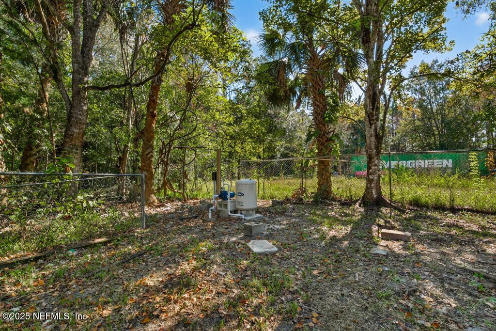 560 Quarter Horse Lane Bunnell, FL 32110 - Photo 62 of 66 a backyard of a house with lots of green space