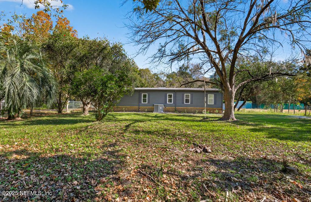 560 Quarter Horse Lane Bunnell, FL 32110 - Photo 63 of 66 a view of a house with a yard