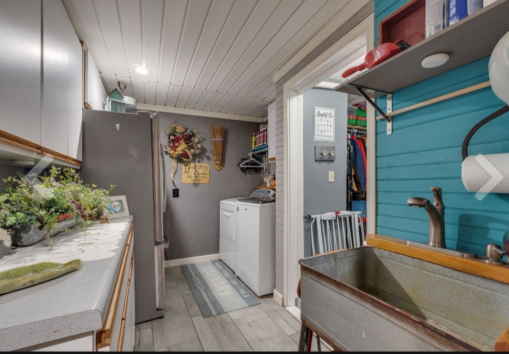 210 South 6th Street Pulaski, TN 38478 - Photo 24 of 44 a kitchen with a sink and refrigerator