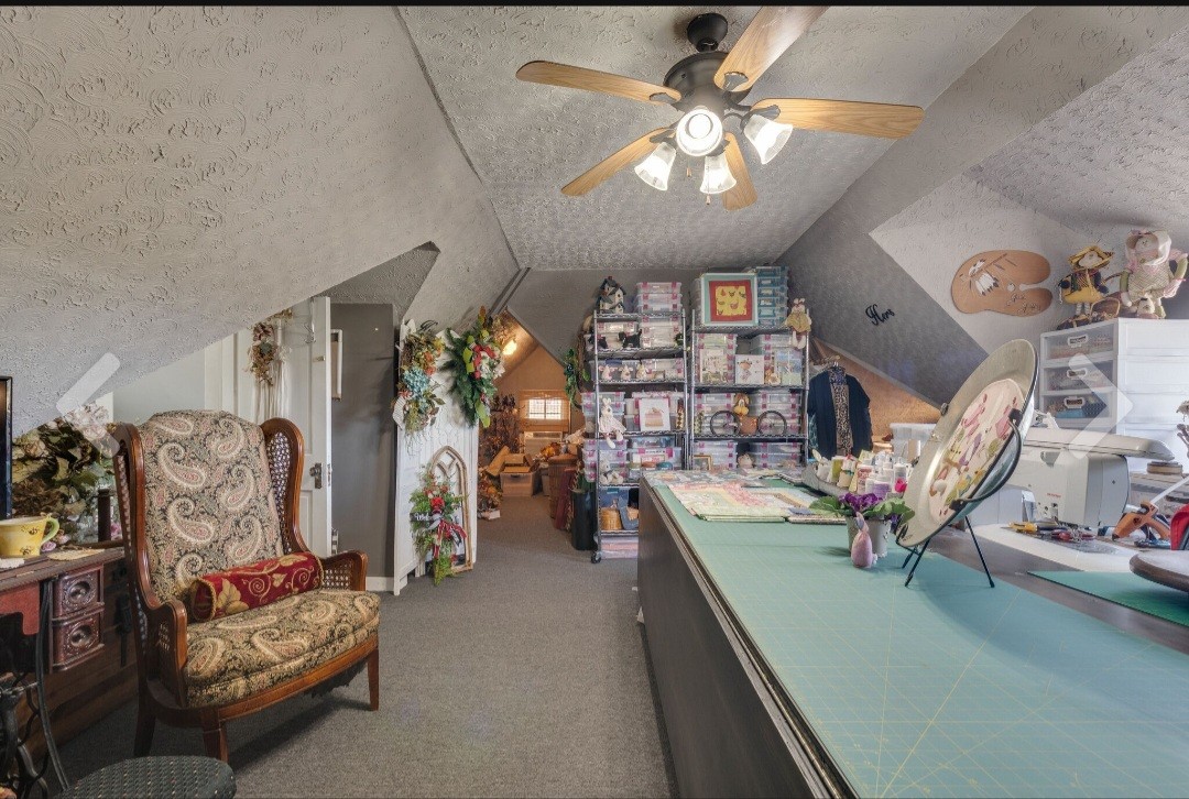 210 South 6th Street Pulaski, TN 38478 - Photo 26 of 44 a living room with furniture and chandelier