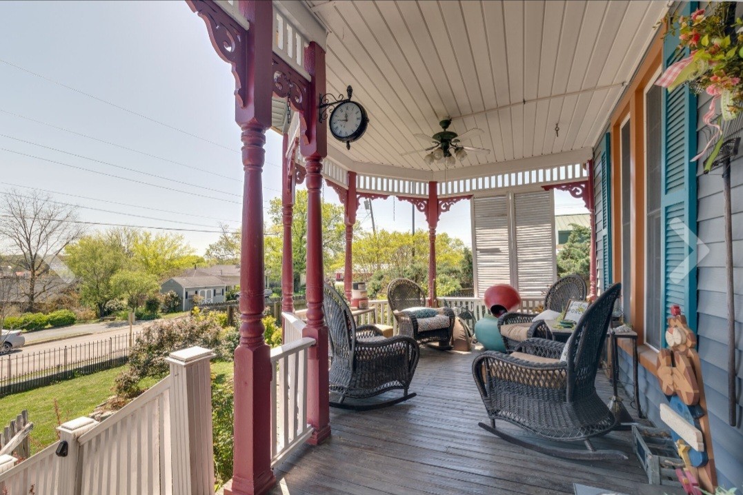 210 South 6th Street Pulaski, TN 38478 - Photo 4 of 44 a view of a porch with furniture and wooden floor