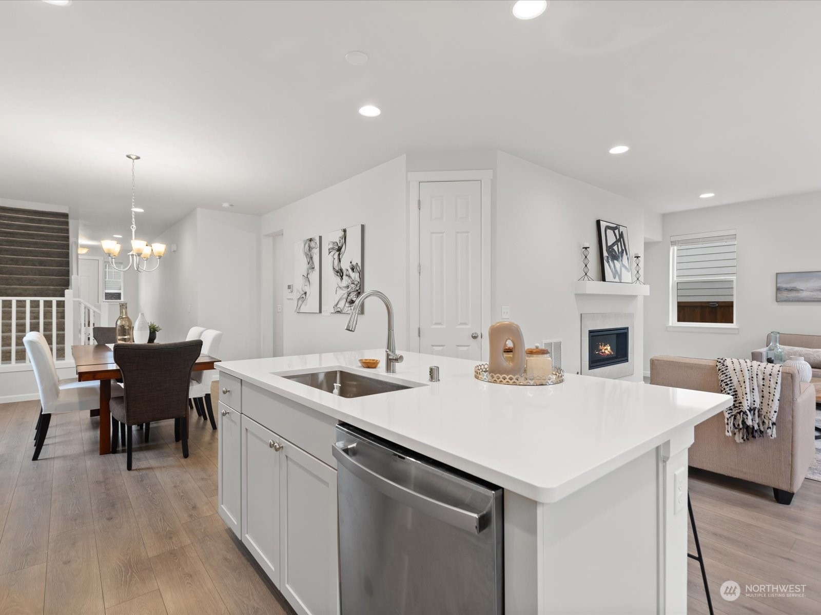 9752 Prospect Place Gig Harbor, WA 98332 - Photo 13 of 40 a kitchen with a sink a table and chairs