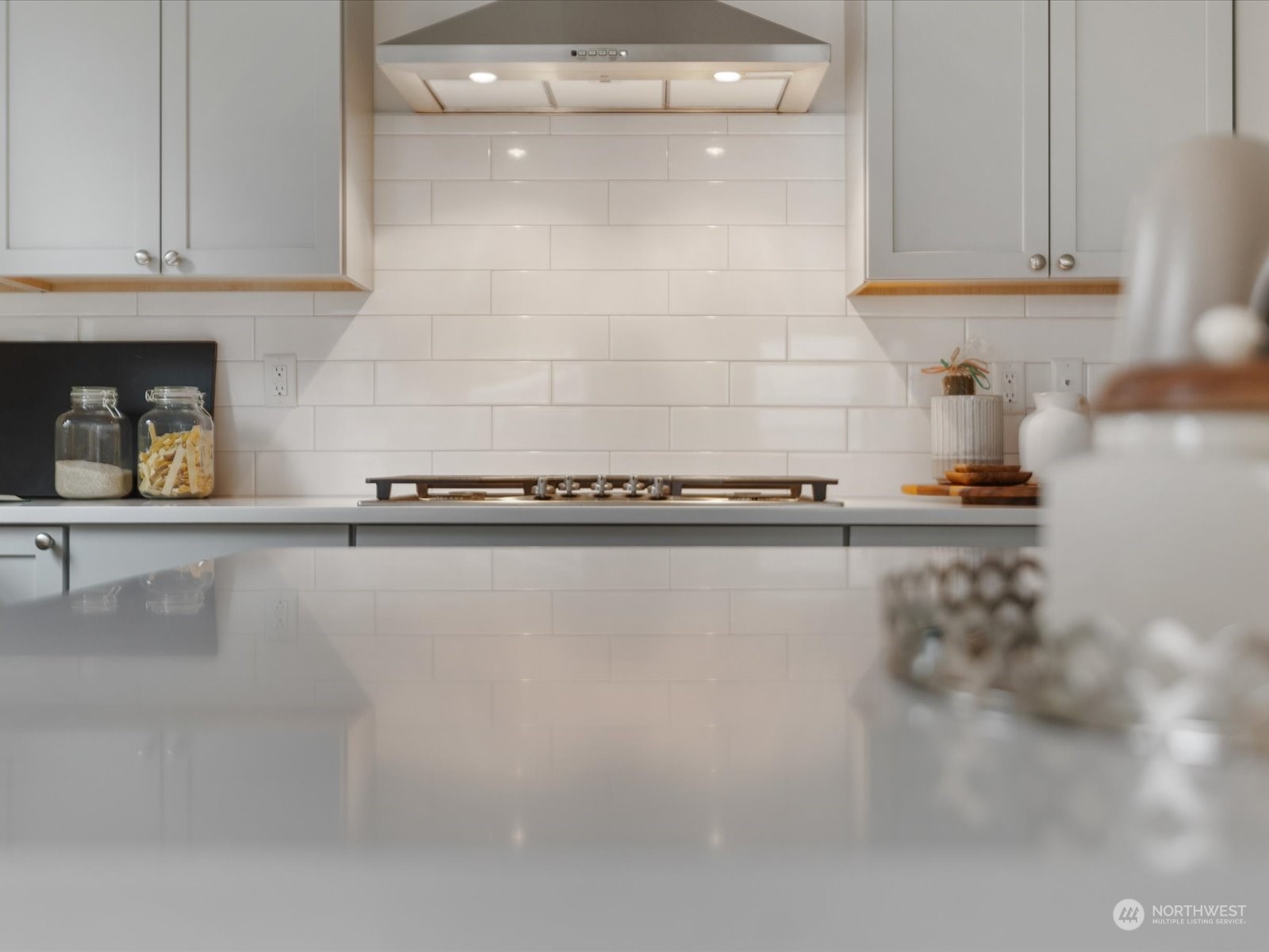 9752 Prospect Place Gig Harbor, WA 98332 - Photo 14 of 40 a kitchen with a sink and cabinets