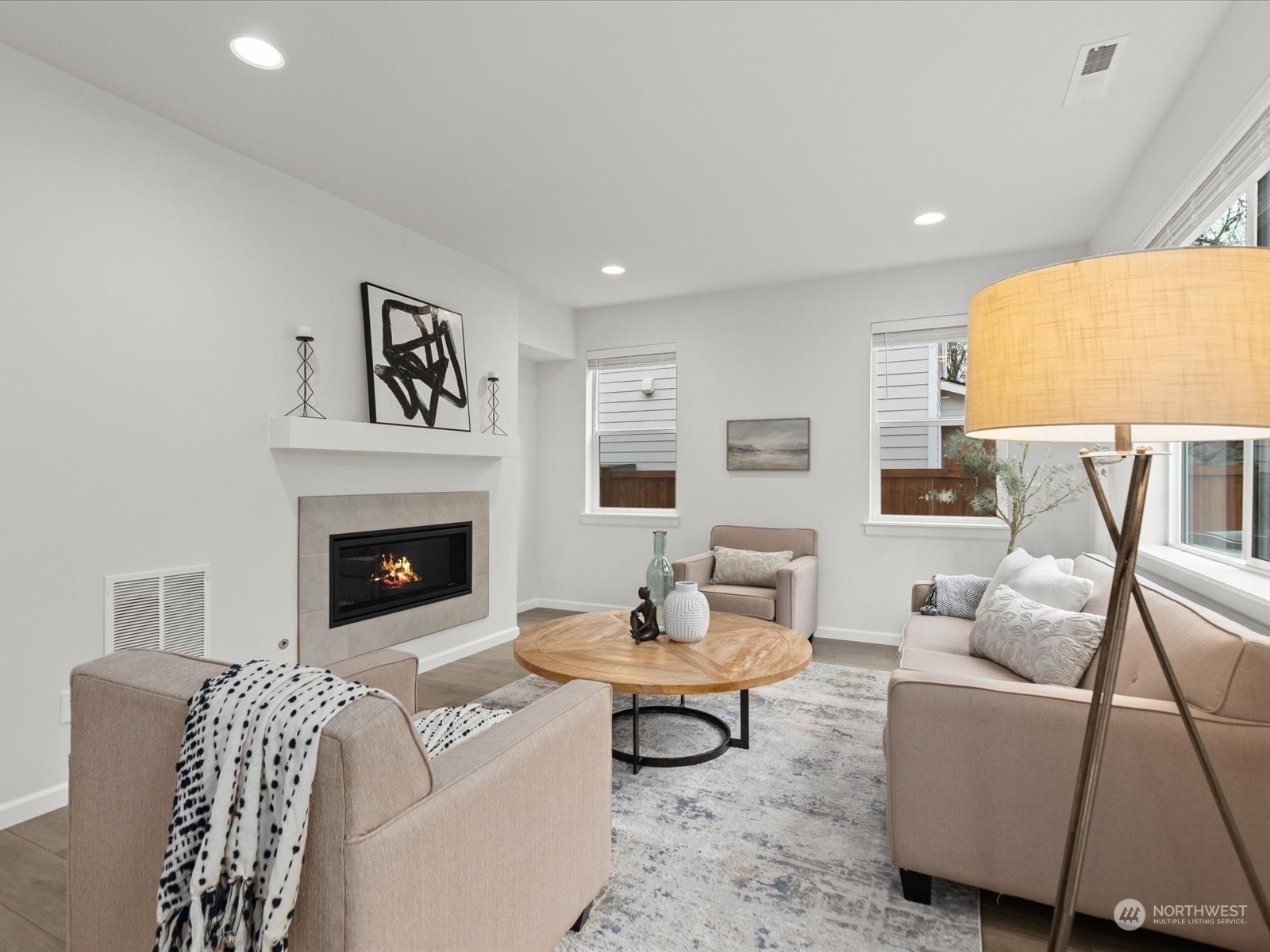 9752 Prospect Place Gig Harbor, WA 98332 - Photo 15 of 40 a living room with furniture and a fireplace