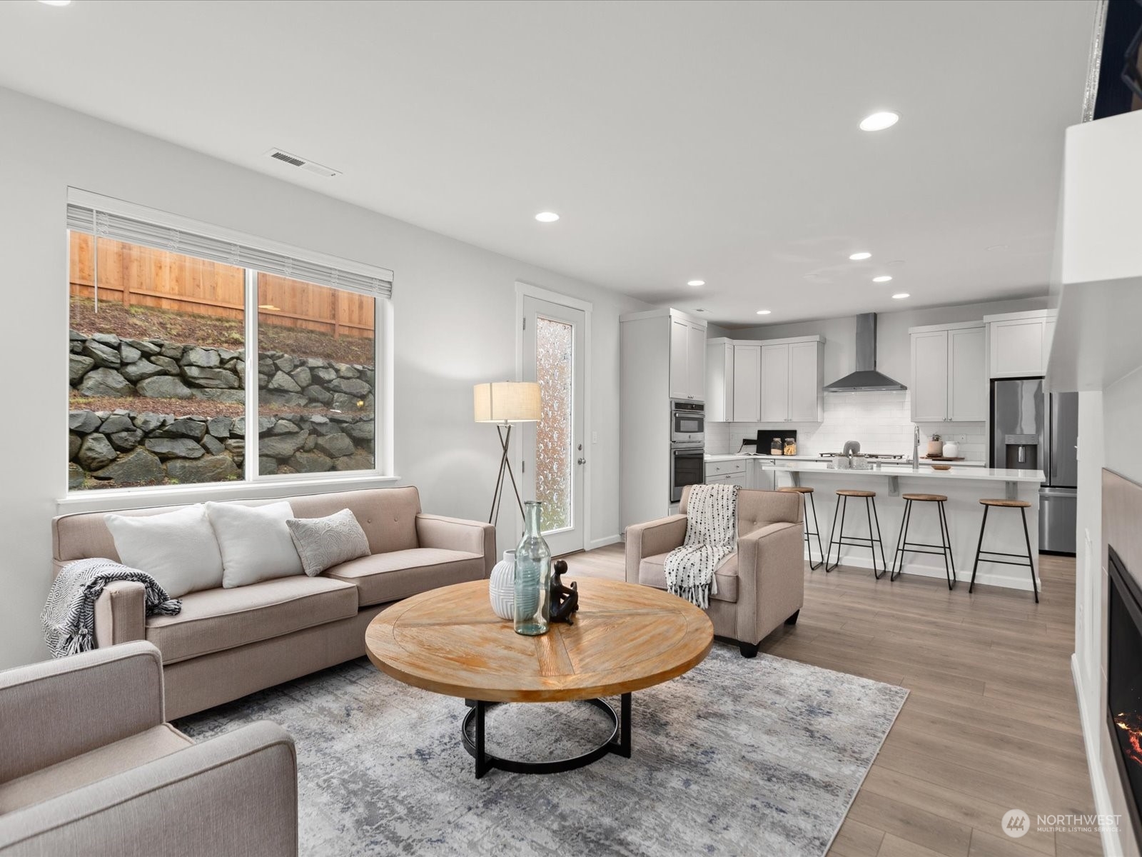 9752 Prospect Place Gig Harbor, WA 98332 - Photo 16 of 40 a living room with furniture and a large window
