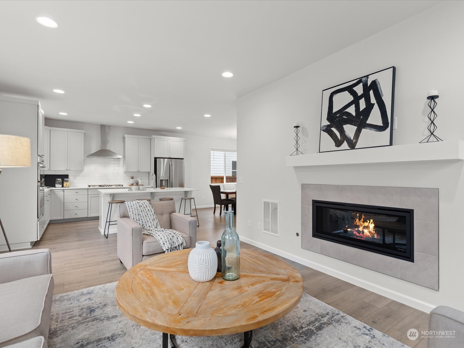 9752 Prospect Place Gig Harbor, WA 98332 - Photo 18 of 40 a living room with furniture and a fireplace