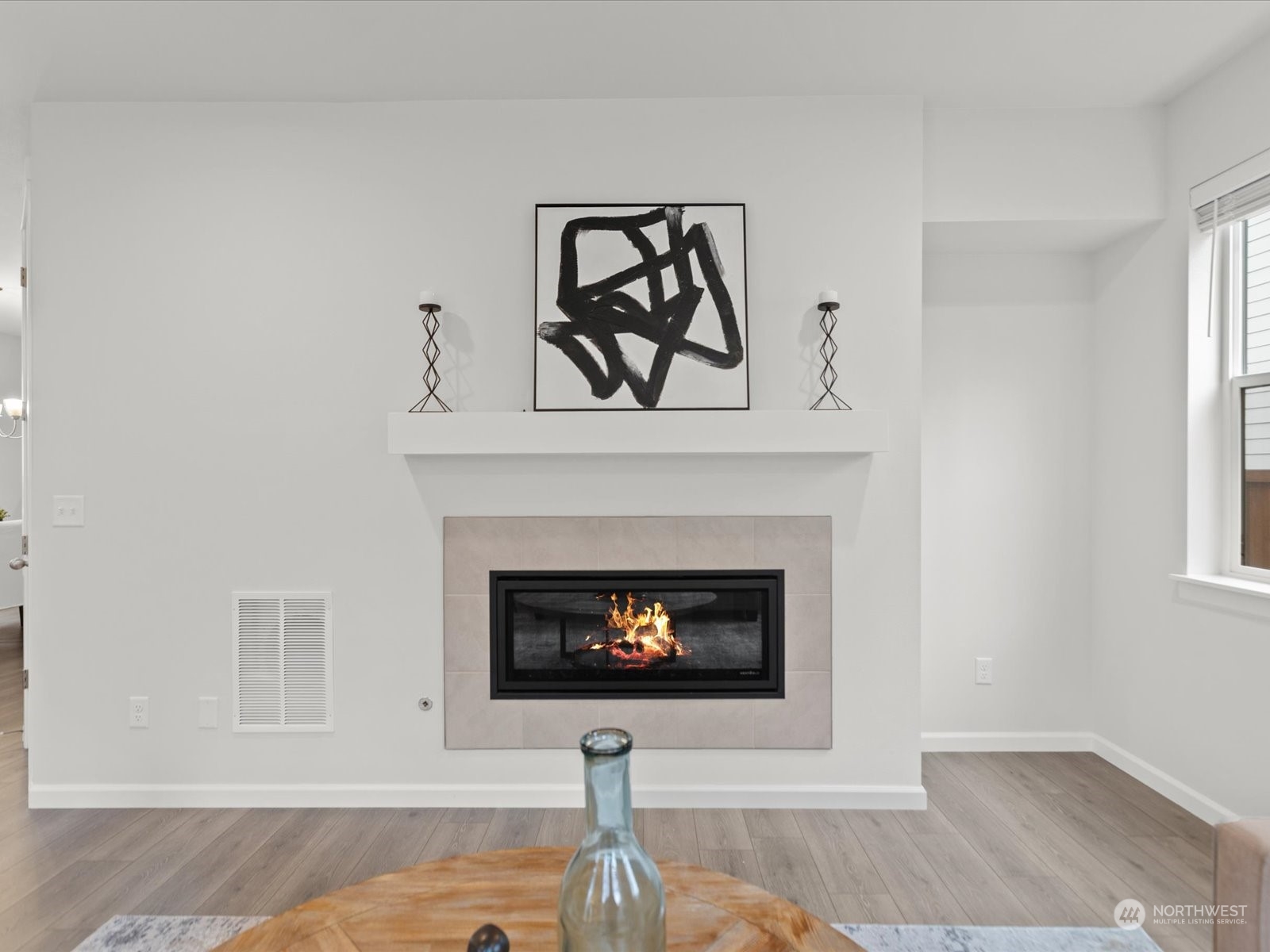 9752 Prospect Place Gig Harbor, WA 98332 - Photo 19 of 40 a living room with a fireplace and a fireplace