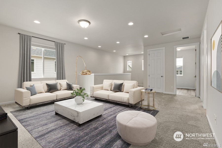 9752 Prospect Place Gig Harbor, WA 98332 - Photo 23 of 40 a living room with furniture and a large window