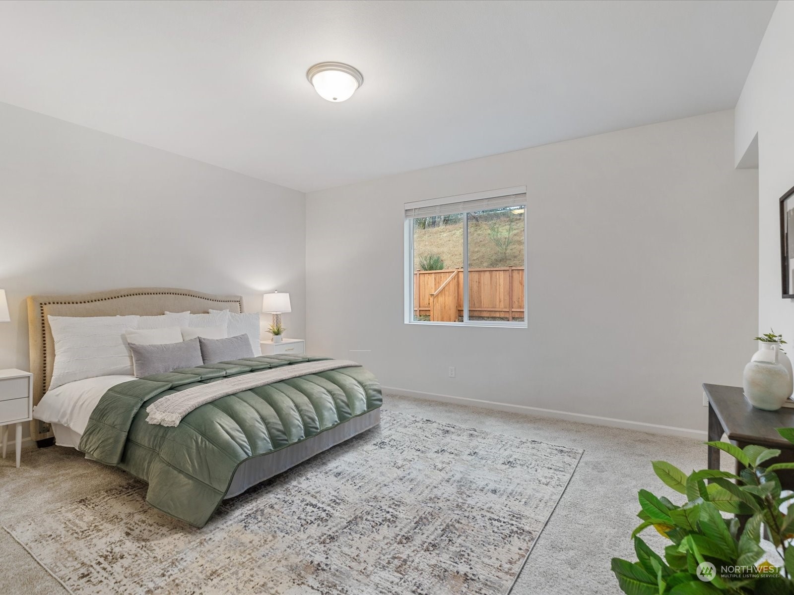 9752 Prospect Place Gig Harbor, WA 98332 - Photo 27 of 40 a bedroom with a bed and a window