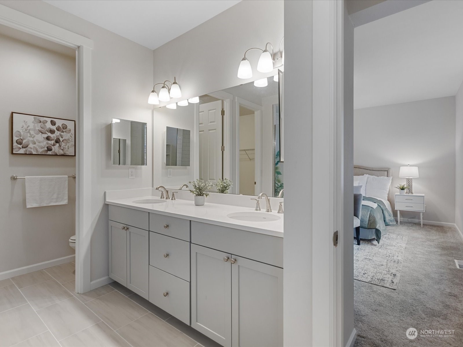 9752 Prospect Place Gig Harbor, WA 98332 - Photo 28 of 40 a en suite bathroom with a double vanity sink mirror and shower