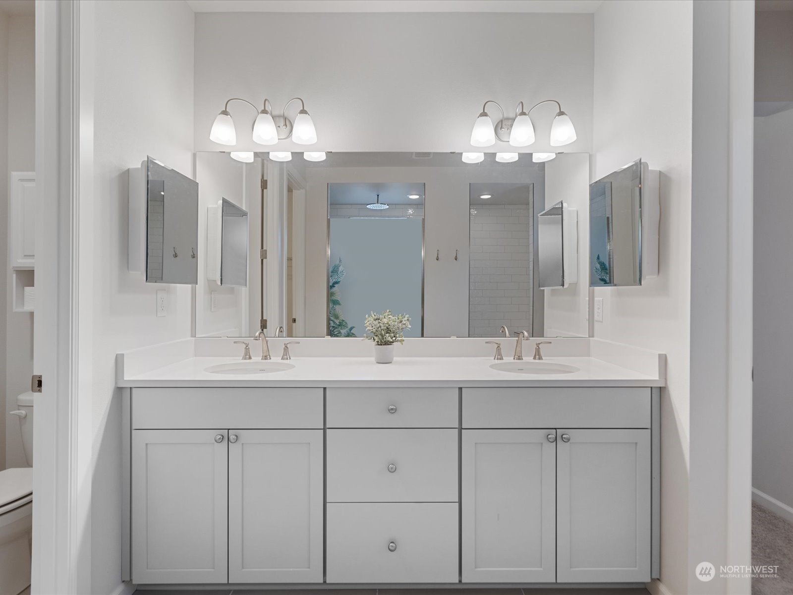 9752 Prospect Place Gig Harbor, WA 98332 - Photo 29 of 40 a bathroom with a sink vanity and a mirror