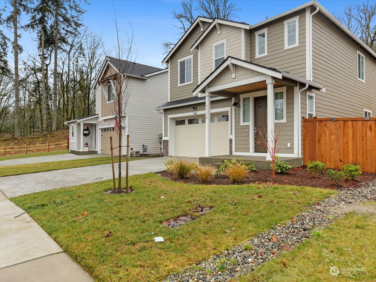 9752 Prospect Place Gig Harbor, WA 98332 - Photo 3 of 40 a front view of a house with a yard