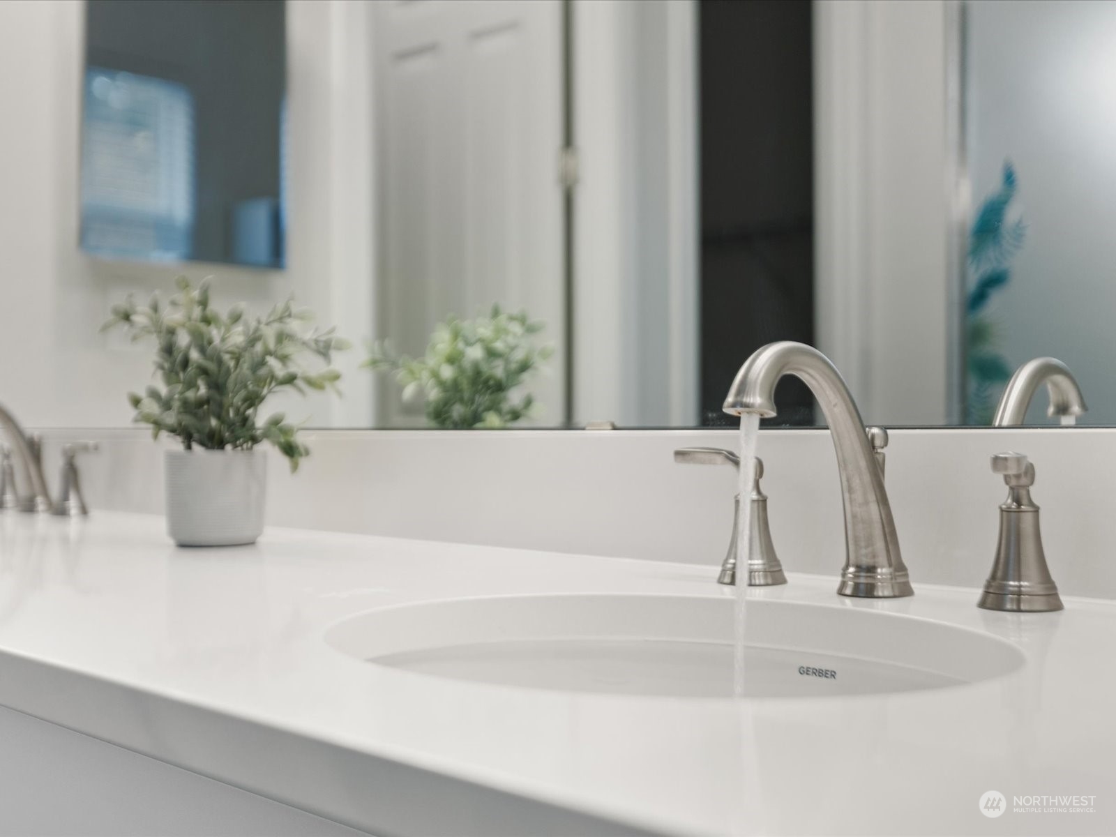 9752 Prospect Place Gig Harbor, WA 98332 - Photo 31 of 40 a sink with a potted plant