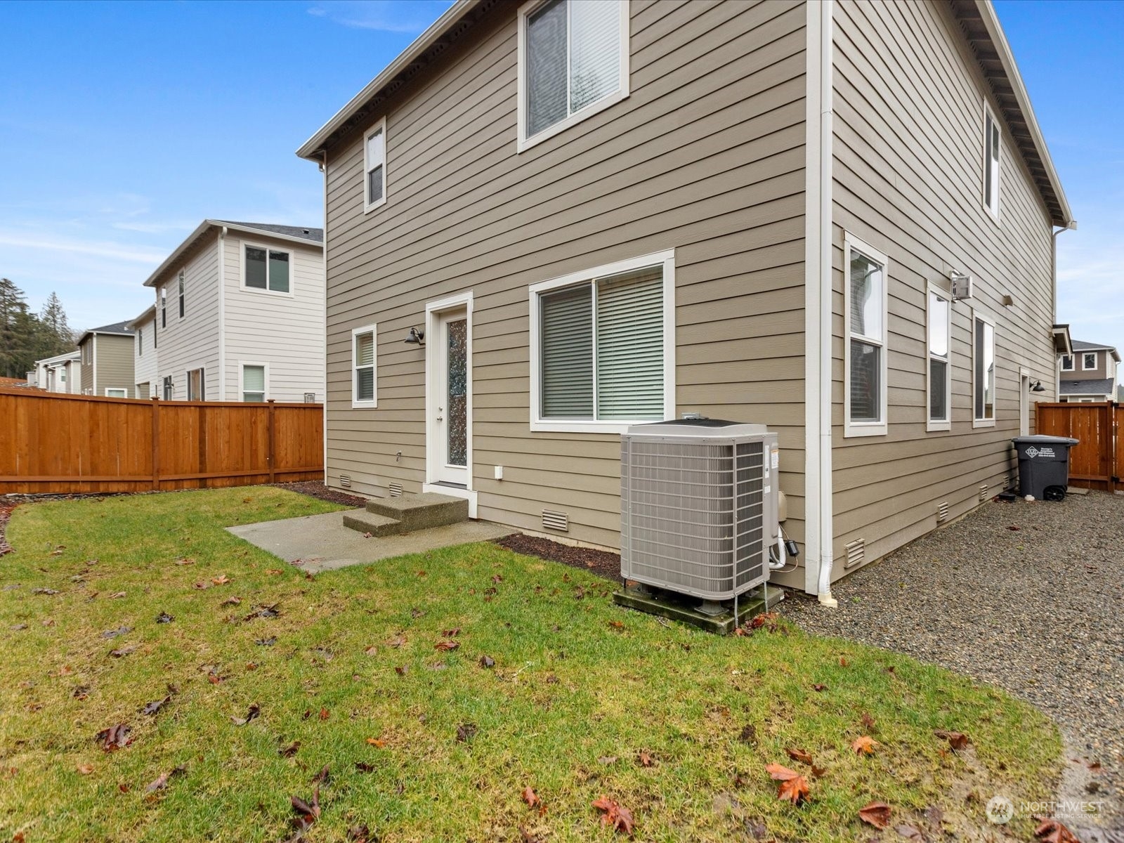 9752 Prospect Place Gig Harbor, WA 98332 - Photo 38 of 40 a view of a backyard with wooden fence