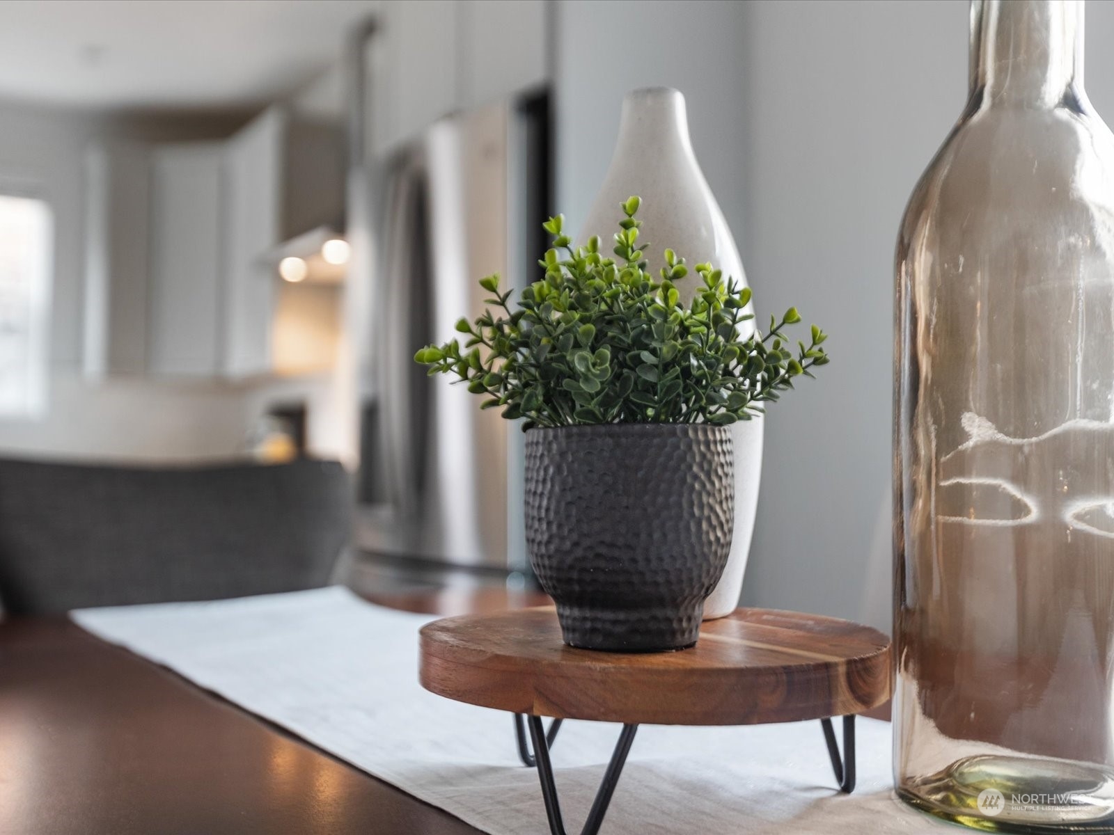 9752 Prospect Place Gig Harbor, WA 98332 - Photo 9 of 40 a view of a vase of flowers sitting on a table