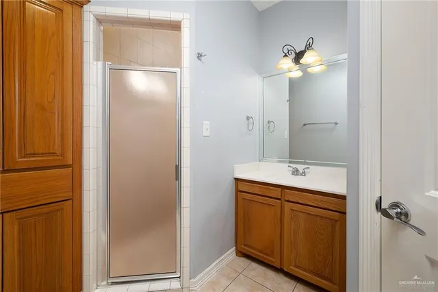 a bathroom with a double vanity sink and mirror