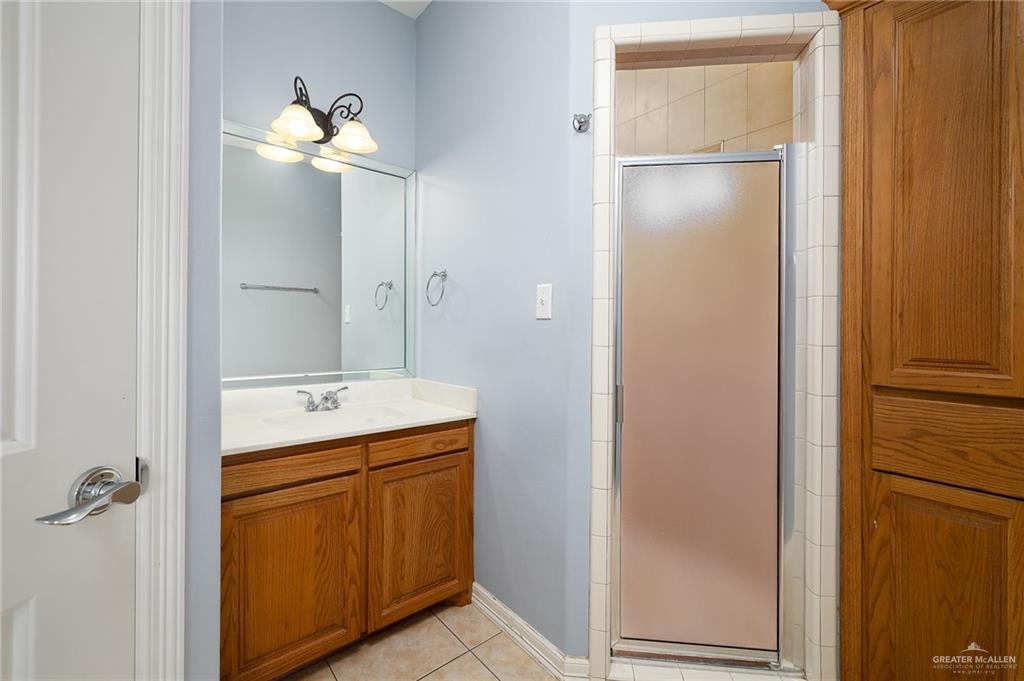 1236 Chloe Rae Circle Weslaco, TX 78599 - Photo 19 of 30 a bathroom with a double vanity sink and mirror